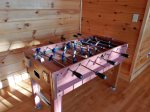 Foosball will keep the kids entertained while the adults play pool.